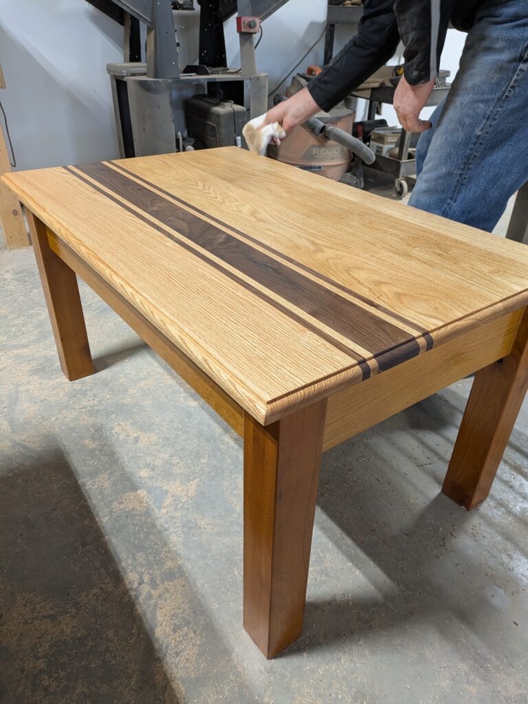 Oak and black walnut coffee table finished in tung oil.